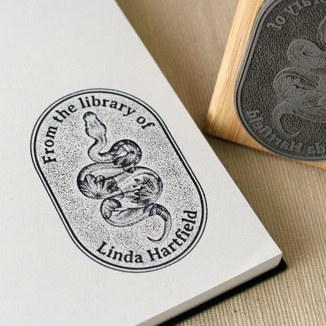 "Design - Ex Libris - Floral Printed Snake 📖  Create your very own book stamp - just add your name! As a thoughtful and unique gift for a book lover, or for your own personal book collection, making your very own customized library stamp has never been easier. * HOW TO ORDER 1. Need an ink pad? - Yes (black) / No ♡ To add colored ink pads, select *(No). 2. Type the exact text you would like featured on your stamp, in the personalization field above.  3. Purchase Item. Done! 🖤 *(Colored ink pad Personal Library Stamp, Book Lover Gift Ideas, Ex Libris Stamp, Stamp Book, Lover Gift Ideas, Book Logo, Book Stamp, Seal Stamps, Ex Libris