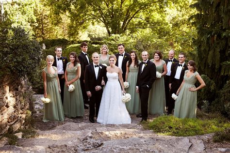 The bridal party was decked out in classic formal attire; the girls wore long sage green gowns with cap sleeves, while the guys wore sleek black tuxedos with black bow ties. Bridesmaid Dresses Pattern, Sage Bridesmaids, Dresses With Cap Sleeves, Patterned Bridesmaid Dresses, Botanical Garden Wedding, Sage Bridesmaid Dresses, Dresses Pattern, Green Tuxedo, Sage Green Bridesmaid Dress