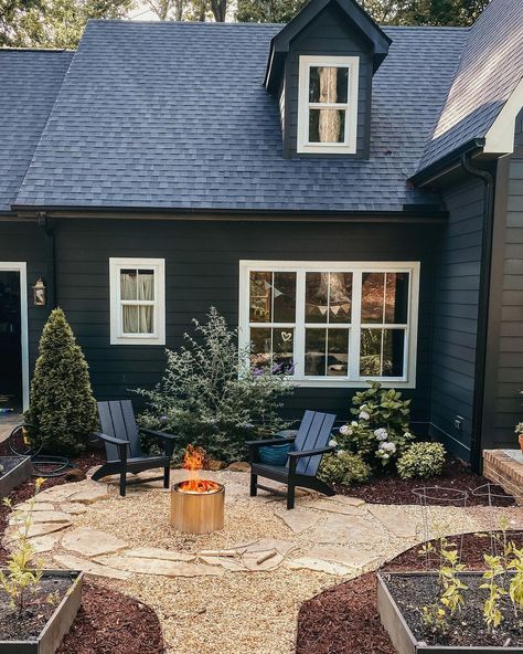 So many of you said as I’ve been talking about the fairy tale cottages (see my last reel) that our house felt like one of them! I designed… | Instagram Side Of House Oasis, Dark House Landscaping, Black Ranch House, Dark Blue Exterior, Dark Home Exterior, Dark House Exterior, Dark Exterior House, Outside Paint Colors, Black Cottage