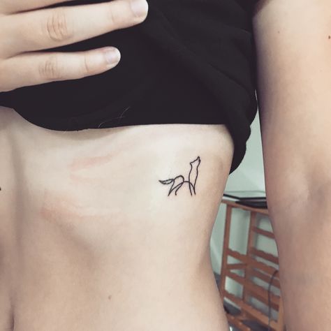 One line wolf tattoo Wolf Tattoo For Women Wrist, Wolf Rib Tattoo, Linework Wolf Tattoo, Line Wolf Tattoo, Dainty Wolf Tattoo For Women, Simplistic Wolf Tattoo, Wolf And Moon Tattoo Minimalist, Delicate Wolf Tattoo, Wolf Outline Tattoo Simple