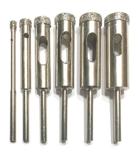 The six most popular diamond drills in one set. Fits your Dremel tool, drill or drill press.. FREE 5 page How To Drilling Guide 1/8, 1/4, 5/16, 3/8, 7/16, and 1/2 sizes are included. 1/8 shank to fit your Dremel tool FREE shipping in the US 100% Money back guarantee. No Dremel Werkzeugprojekte, Dremel Tool Bits, Dremel Bits Guide, Sculpture Dremel, Dremel Tool Accessories, Drilling Glass, Dremel Tool Projects, Dremel Bits, Dremel Drill