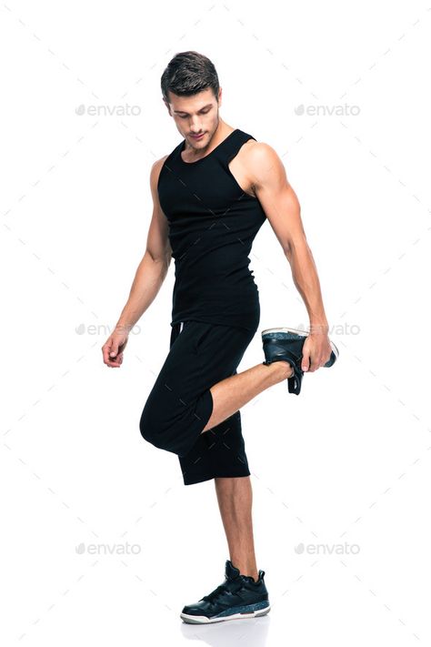 Sports man stretching legs by vadymvdrobot. Full length portrait of a sports man stretching legs isolated on a white background#legs, #vadymvdrobot, #Full, #Sports Man Stretching Reference, Man Stretching, Leg Reference, Healthy Man, Standing Poses, Man Standing, Leg Stretching, Studio Photoshoot, Photographs Ideas