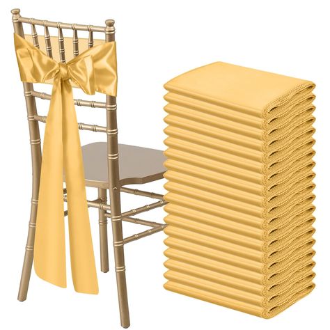 PRICES MAY VARY. Size & Package:You will get 50 pieces gold satin chair sashes, and the size is about 108" x7" or 275cm(l) x 17cm(w). These chair ties adopt flating packing, please to tie the bow by yourself. Each package includes chair sashes only, no chair covers Premium Satin Fabric:Our chair sash is made of 120GSM stain fabric, it is beautifully shiny glossy and smooth, silky to the touch, vibrant in color. The chair bows sashes meticulously stitched with matching thread finished edges. They White Chairs Wedding, Wedding Party Reception, Tiffany Chair, Luxury Weddings Reception, Party Reception, Chair Bows, Chair Ties, Banquet Decorations, Chair Sash