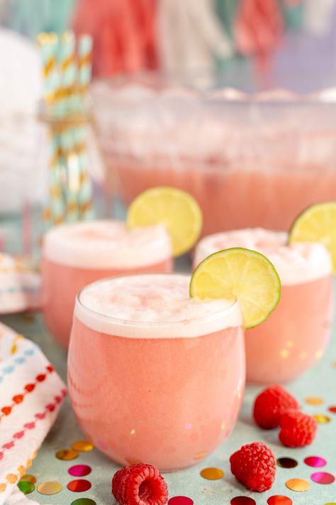 The best pink punch for baby showers, bridal showers, princess parties, and more! Easy Pink Punch, Baby Shower Punch For Girl, Pink Baby Shower Punch, Pink Punch Recipe, Pink Punch Recipes, Shower Punch, Easy Drinks To Make, Raspberry Drink, Baby Shower Punch