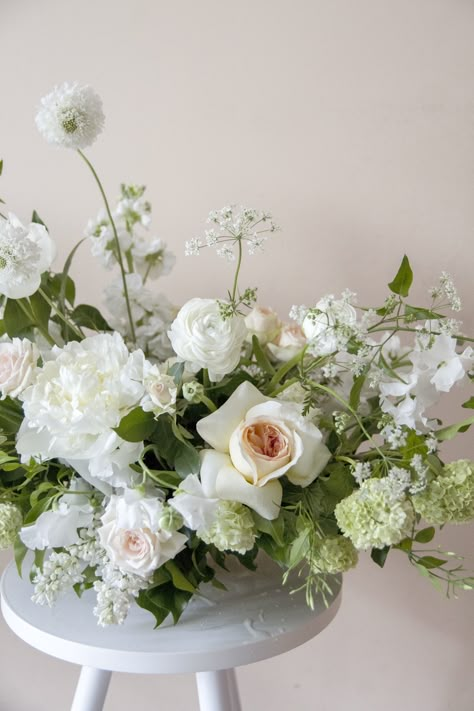 Classy White Flower Arrangements, Whimsical White Flower Arrangements, White Ground Floral Arrangement, Romantic Garden Wedding Flowers, French Garden Wedding Flowers, 2023 Wedding Floral Trends, White Delphinium Wedding, Neutral Floral Centerpieces, All White Wedding Florals