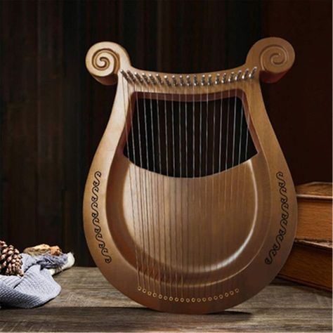 Lyre Harp Aesthetic, Lyre Aesthetic, Lyre Instrument, Piano Home, Wooden Instruments, Lyre Harp, Ancient Music, Thumb Piano, Folk Instruments