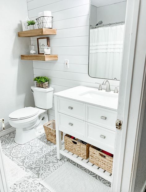 Light and bright updated half bath with white shiplap, light gray walls, and gray vinyl tile meant to look like cement tile. Makeover Kamar Mandi, Small Bathroom Wallpaper, All White Bathroom, Shiplap Bathroom, Casa Country, White Vanity Bathroom, Bathroom Remodel Shower, Bathroom Remodel Designs, Half Bathroom