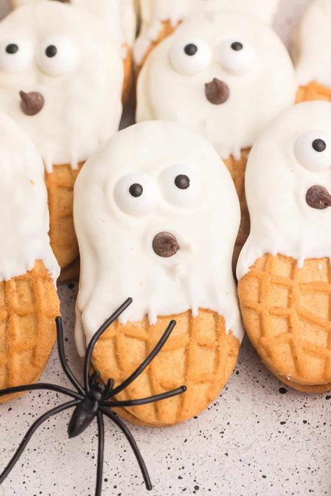 Nutter Butter Ghosts | Butter Your Biscuit Melted White Chocolate, Spooky Candy, White Chocolate Candy, Candy Eyeballs, Ghost Cookies, Nutter Butter, Melting White Chocolate, Chocolate Candy Melts, Halloween Kitchen