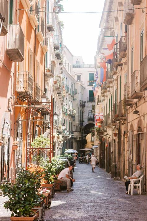 People sitting in a street in Salerno, Italy Salerno Italy Pictures, Little Italy Party, Italy Engagement, Italy Party, Salerno Italy, Italy Restaurant, Working Abroad, Italian Trip, Italy Pictures