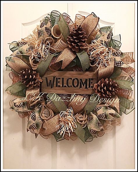 This Welcome pinecone wreath will bring a great woodsy atmosphere to your rustic home. It is made on a wired wreath form with high-quality burlap, forest green and brown deco mesh. It shows with beautiful large Scottish pinecones, burlap bows and raffia. Measuring 24 inches this wreath can ship out within 7 to 10 business days after purchase. Burlap Xmas Wreath, Fall Deco Mesh Wreath Ideas, Fall Wreath Ideas Diy, Wreath Pinecone, Wine Cork Wreath, Fall Mesh Wreaths, Fall Deco Mesh Wreath, Mesh Ribbon Wreaths, Fall Decor Wreaths