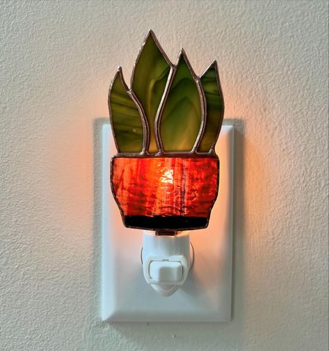 Swipe to turn on the light! 🪴 Stained glass nightlights coming soon! ✨ . . #plantlover #snakeplant #stainedglassart #botanicalart Stained Glass Nightlight, Glass Night Lights, Stained Glass Night Lights, Daisy Ring, Snake Plant, New Home Designs, Stained Glass Art, Night Lights, Plant Lover