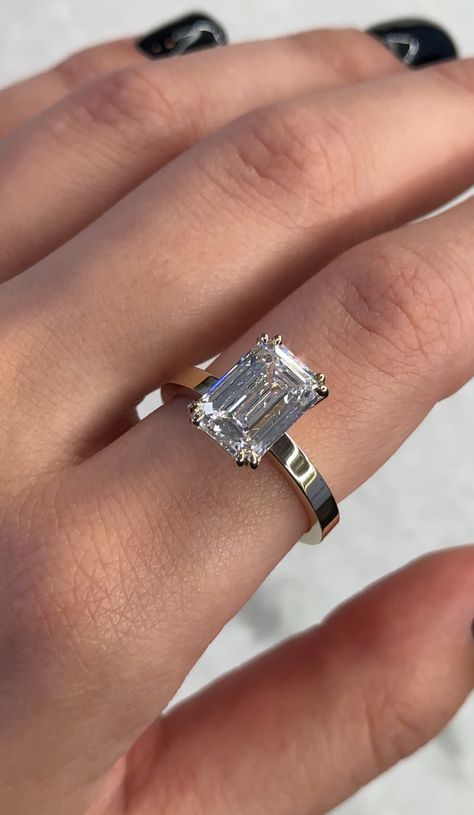 4ct emerald cut diamond on a flat yellow gold band Emerald Cut Thick Gold Band, Emerald Cut Engagement Ring Thick Band, Engagement Rings With Thick Band, Flat Band Engagement Rings, Thick Gold Band, Radiant Cut Rings, Emerald Wedding Band, Ring Inspo, Emerald Cut Diamond Ring