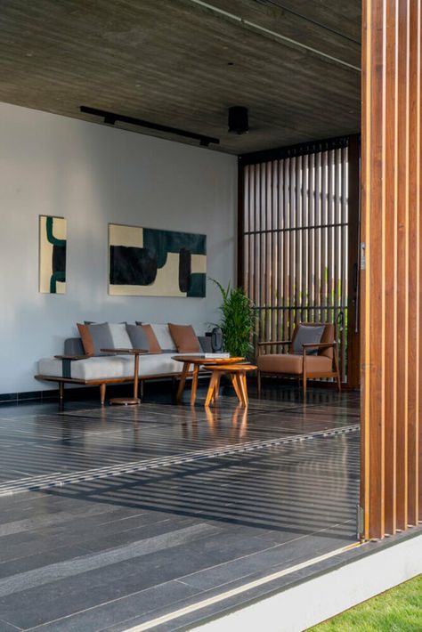 workspace in india showcases a material palette of wood, and kota stones Kota Stone Flooring, Sliding Folding Doors, Timber Buildings, Concrete Wood, Material Palette, Formal Living, Studio Space, Stone Flooring, Office Interior Design