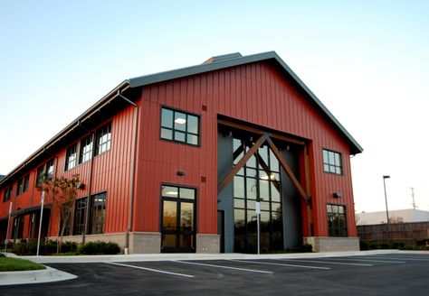 Board and Batten exterior finish with standing seam roof, commercial storefront and exposed wood structural elements create an Annapolis twist on a Pacific Northwest American look. This 2 story office building is set up to be for mix of Office and Retail end users. Warehouse Business Ideas, Modern Warehouse Design Exterior, Warehouse Aesthetic, Industrial Building Design, Commercial Steel Buildings, Board And Batten Exterior, Metal Building Designs, Factory Architecture, Commercial And Office Architecture