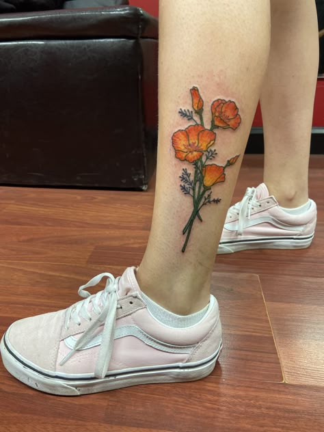 photo of a girls leg with a tattoo of orange california poppies. the girl is wearing pink sneakers. California Poppy Tattoo Color, California Poppies Tattoo, California Poppy Flower Tattoo, Orange Poppy Tattoo, Ca Poppy Tattoo, Simple Poppy Tattoo, Poppy Tattoo Meaning, Garter Tattoos, California Poppy Tattoo