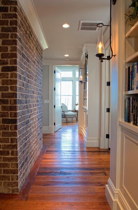 Crown Molding Black, Brick Wall With Crown Molding, Baseboard On Brick Wall, Bricks Flooring, Interior Brick Walls, Hallway House, Interior Brick, Palmetto Bluff, Stone Interior