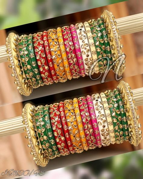 Indian Designer Multi Color Bridal Bangles Set. Decorated With Glass Kundan Work All Over. Made On Acrylic Base. All The Popular Colors In This Beautiful Ensemble Are Ready To Go With Every Of Your Dress. Be An Angel And Create A Splendid Impact On Everyone By Wearing This Gorgeous Design. This is a set of 28 Bangles (14 Bangles For Each Hand). Colorful Bangles Indian, Beautiful Bangles, Glass Bangles Indian, Couple Ring Design, Colourful Bangles, Bangle Collection, Punjabi Style, Silk Thread Bangles Design, Designer Bangles