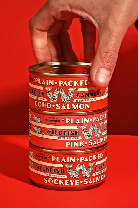 In their work for Alaskan fish company Wildfish, Young Jerks connects the wider interest in tinned fish to a growing popularity of tins with a charming vintage aesthetic. While its midcentury typography and old-school symbology feels current, the agency actually wanted to swerve away from trendiness and lean into a timeless feel. We think these thoughtful red tins hit the nail on the head. Tinned Fish, Foil Business Cards, Square Business Cards, Lata Vintage, Vintage Packaging, Beer Packaging, Food Packaging Design, Graphic Design Trends, Beverage Packaging