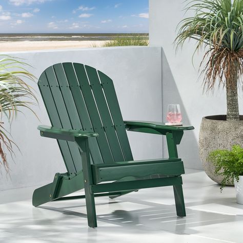 There's nothing quite like relaxing in your own backyard and enjoying the fresh breeze in a chair made for your comfort. Outside Pool, Folding Adirondack Chair, Wood Adirondack Chairs, Wooden Adirondack Chairs, Folding Adirondack Chairs, Outdoor Folding Chairs, Backyard Deck, Outdoor Rocking Chairs, Deck Garden