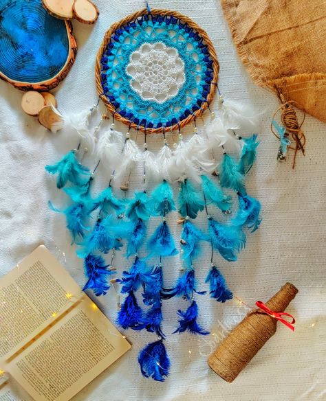 Hey, this is a big blue crochet dreamcatcher. The blue coloured feathers  has been arranged as from light to dark shades to feel the transition. Blue Dream Catcher, Crochet Dreamcatcher, Coloured Feathers, Blue Crochet, Blue Dream, Dreamcatchers, Dark Shades, Big Blue, Dream Catcher