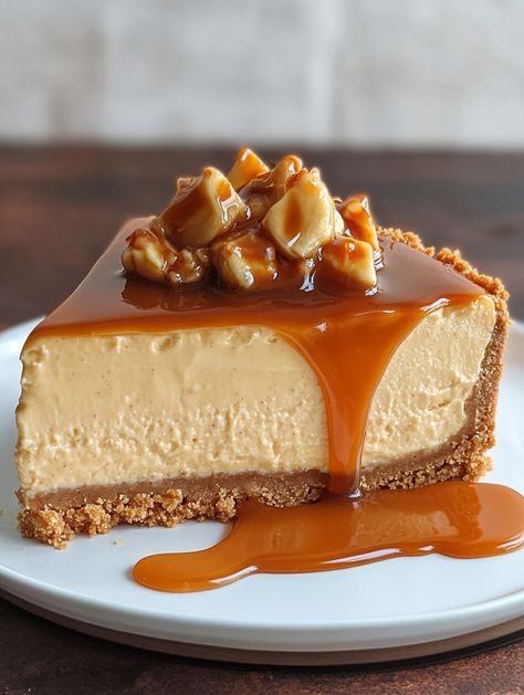 Almond Crust Banana Caramel Cheesecake 🍌🍮  🍌 𝗜𝗻𝗴𝗿𝗲𝗱𝗶𝗲𝗻𝘁𝘀 🍌 - 1 1/2 cups almond meal - 1/4 cup granulated sugar - 1/4 cup unsalted butter, melted - 3 (8 oz) packages cream cheese, softened - 1 cup granulated sugar - 1 teaspoon vanilla extract - 3 large eggs - 1 cup sour cream - 1/2 cup heavy cream - 2 ripe bananas, mashed - 1 cup caramel sauce Almond Caramel Cake, Almond Caramel, Cheesecake Ingredients, Almond Crust, Banana Caramel, Cream Caramel, Almond Crusted, Almond Meal, Caramel Cheesecake