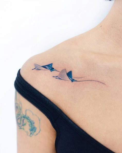 Watercolor style stingrays tattooed on the shoulder. Sting Ray Tattoo With Flowers, Small Stingray Tattoos For Women, Two Manta Rays Tattoo, Cownose Stingray Tattoos, Stingray Tattoo Meaning, Aquatic Animal Tattoos, Sting Ray Tattoo Simple, Simple Stingray Tattoo, Small Stingray Tattoo