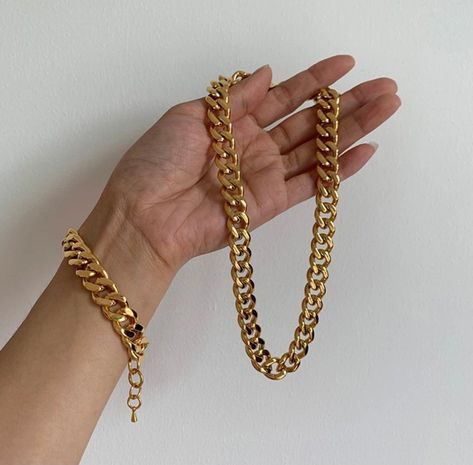 "18K Gold Filled Cuban Chain Necklace | Gold Filled Cuban Chain | Chunky Cuban Chain | Cuban Bracelet | Thick Cuban Necklace | Gold Cuban Choker 12 MM Material: 18K Gold Filled Closure: There secure nicely with a beautiful lobster clasps Cuban Necklace Length: 15\" Width: 12MM Cuban Bracelet: Length: 6\" +1\" Width: 12 MM WATERPROOF *Tarnish resistant *8 layers of 18K Gold Filling for the lasting shine *Comes in a velvet gift bag, ready as a gift Gorgeous, high-quality 18 karat gold filled Cuban Gold Cuban Link Chain, Cuban Chain Necklace, Cuban Link Chain Necklaces, Chunky Chain Necklaces, Necklace Chain Lengths, Chain Anklet, Cuban Chain, Metal Bracelets, Stainless Steel Necklace