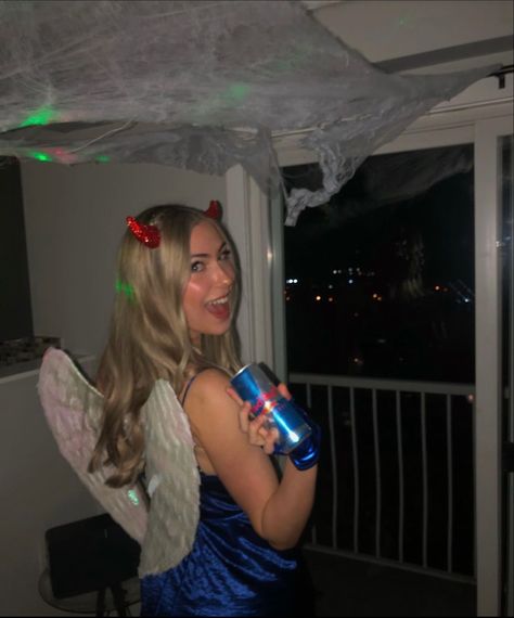 Redbull gives you wings Halloween costume, blue dress with dIY felt cut out logos pinned on with flip on devil horns angles wings shiny blue gloves white cowboy boots and red knee high socks Vodka Redbull Costume, Halloween Costumes Redbull, Redbull Halloween Costume, Red Bull Halloween Costume, Redbull Costume, Red Bull Costume, Halloween Duo, Basic Halloween Costumes, Angel Halloween