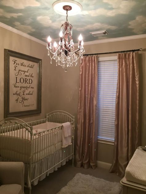 neutral nursery with chandelier & clouds on ceiling Cherub Nursery Theme, Nursery With Chandelier, Nursery Cloud Ceiling, Star Ceiling Nursery, Heaven Sent Nursery Theme, Heaven Nursery Theme, Nursery With Painted Ceiling, Wallpaper On Ceiling Nursery, Angel Nursery Theme