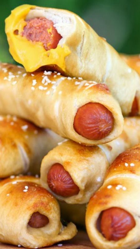 Simple Homemade Pretzel Dogs ~ A hot dog baked right inside a soft beer pretzel makes these the tastiest and easiest homemade pretzel dogs you will ever eat! Ready in just 35 minutes you can enjoy these any night. Homemade Pretzel Dogs, Pretzel Dogs Recipe, Homemade Pretzel, Pretzel Dogs, Homemade Pretzels, Hot Dog Recipes, School Snack, Football Food, Snacks Für Party