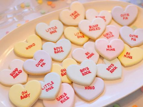 50 Epic Ways to Throw a Gender Reveal Party | The Dating Divas Hearts Baby Shower Theme, Sweethearts Candy, Valentines Gender Reveal, Best Gender Reveal, February Baby Showers, Themed Gender Reveal, Sweetheart Candy, Gender Reveal Cookies