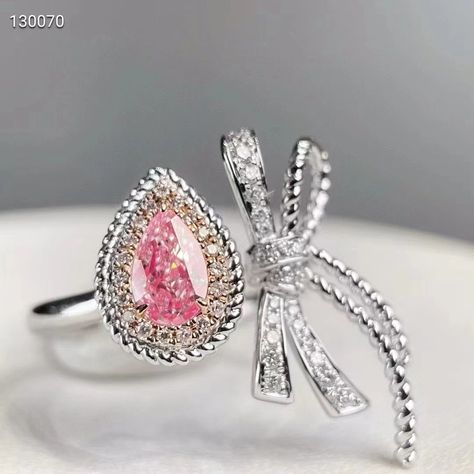 Why You Need This Ring: For the elite who crave unparalleled beauty and exclusivity, this ring is a must-have. The rare fancy pink diamond and elegant design promise a unique touch to any ensemble. Key Features: Main Stone: 0.60 CT Pear Cut Fancy Pink Diamond, VS Clarity Side Stones: 0.225 CT Total, White Diamonds Material: 18k White Gold Total Weight: 5.06g Size: Adjustable #PinkDiamondRing #NaturalDiamond #18kGold #LuxuryJewelry #ElegantDesign #CertifiedDiamond #ExclusiveJewelry #Sop... Pink Diamond Ring, Total White, Diamond Jewelry Designs, Exclusive Jewelry, Pink Diamond, Pear Cut, White Diamonds, Jewelry Designs, Luxury Jewelry