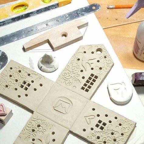 Michelle MacKenzie on Instagram: "It takes an arsenal of tools and gadgets to create one birdhouse luminary! Not shown: my kiln and slab roller!  #workinprogress #wip #artistlife #ceramic #creativityfound #ceramichouses #clayhouses #ceramicart #luminaries #birdhouses #mystudiotoday" Bird House Pottery, House Pottery, House Candle Holder, Clay Fairy, Clay Fairy House, Ceramic Birdhouse, Clay Fairies, Clay Houses, Pottery Handbuilding