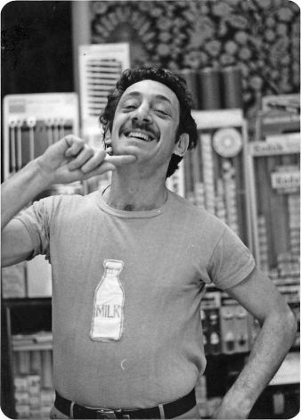 Harvey Milk wears a milk bottle t-shirt in his Castro Camera store (1975) via Harvey Milk Archives, Gay & Lesbian Center, San Francisco Public Library | Photo: From 'Double Play', by Mike Weiss Lgbt Culture, Harvey Milk, Lgbt History, Living In San Francisco, Happy Pride, Play Book, Historical Photos, Human Rights, Documentaries