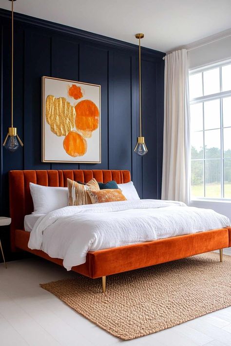 63 Stunning Navy Blue Bedroom Ideas (That Designers Love) Navy Blue Velvet Bedroom Ideas, Rust Velvet Bed, Orange And Blue Bedroom Ideas, Blue And Burnt Orange Bedroom, Navy And Orange Bedroom, Blue Primary Bedroom, Bedroom Decor Navy Blue, Pop Of Color Bedroom, Navy Blue Bedroom Walls