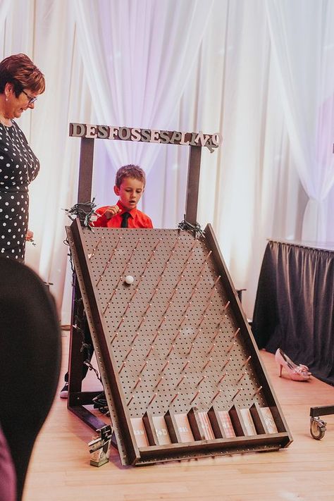 The Plinko board was a lot of fun! We used it for drink tickets at the start of the night, and to replace glass clinking later in the night. #wedding #kissinggames #weddingreception #reception #DIY: Plinko Board, Drink Tickets, Fall Festival Games, Diy Yard Games, Festival Games, School Carnival, Wood Games, Family Fun Games, Wooden Games