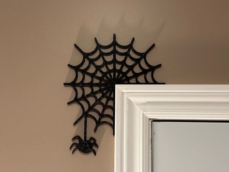 3D Printed Spider Web Door Corner Decorations -the perfect blend of spooky and stylish for your Halloween celebrations! These webbed wonders are meticulously 3D printed, adding a modern twist to a classic holiday staple. Made to order, our Spider webs comes in custom colours that can be tailored to suit your unique preferences and match your festive decor. The easy-to-use design will make your Halloween decorating experience simple, stress-free, and fun! Decorations can be customized in a variety of colours, ensuring that your Halloween decorations stand out or blend in with your decor. Simply let me know your preferred colour in the dropdown selection when ordering. Easy to Install: Each Happy Halloween corner decoration is designed to be able to balance without any adhesive. In the event 3d Printed Halloween Decorations, Halloween 3d Printing, Corner Decorations, Fun Decorations, Halloween 3d, Nature Friendly, Halloween Decorating, Spider Webs, Halloween Trees