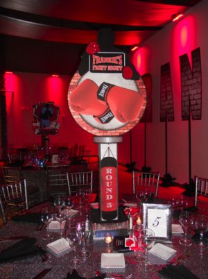 These centerpieces are a combination of signature collage style pieces and 3D elements. Both feature the brick wall feel (to represent the outside of a boxing gym) and then boxing gloves and a silhouette of a boxer. [Two different images are back to back.] www.partyexcellence.net Boxing Party Centerpieces, Ufc Party, Boxing Theme Party Ideas, Boxing Party, Boxing Birthday, Wwe Birthday, Mitzvah Themes, Boxer And Baby, 3d Elements