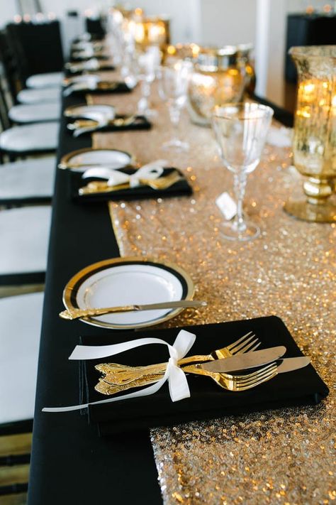 A glamorously decorated table perfect for a black and white wedding theme seeking an extra flair. | A Brit & A Blonde Gold Sequin Table Runner, Gold Table Runners, Rustic Wedding Decorations, Sequin Table Runner, Black Gold Wedding, Sequin Table, Holiday Dinner Party, Gold Wedding Theme, Warehouse Wedding