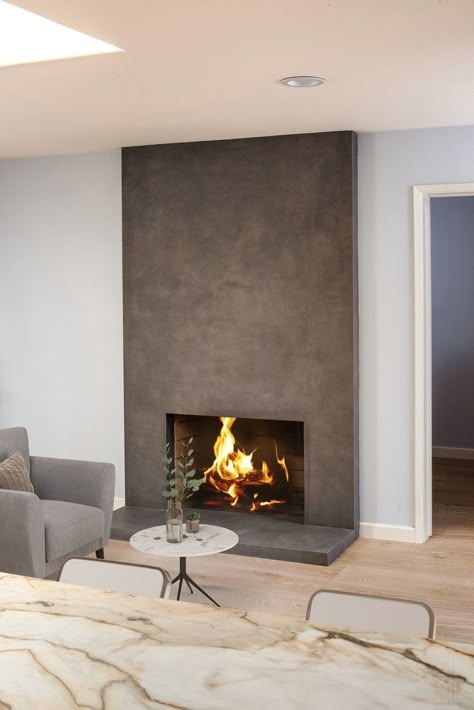 Urban Argento - Moderno Porcelain Works Wood Burning Fireplace In Bedroom, Gray Concrete Fireplace, Concrete Gas Fireplace, Fireplace Indoor Living Rooms, Fireplace Design Idea, Fireplace Material Ideas, Seamless Fireplace, Modern Fireplace With Hearth, Stone Slab Fireplace