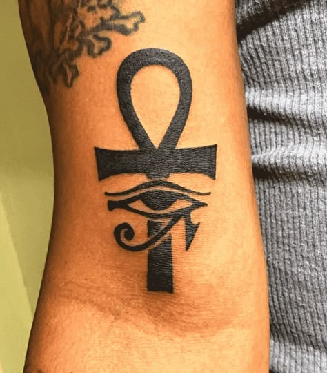 180 Excellent Ankh Tattoo Designs with Meanings (2022) - TattoosBoyGirl Ankh Arm Tattoo, Ankh Eye Tattoo, Ankh Eye Of Horus Tattoo, Ankh Tattoo Women Chest, Key Of Life Tattoo, Ankh Tattoo Women, Ankh Tattoo Design, Eye Of Ra Tattoo, Powerful Tattoos