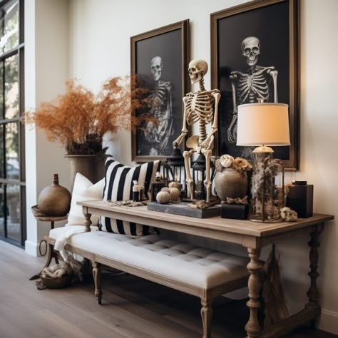 Halloween indoor decor styling - how to create a stylish entryway table with spooky foyer home decorations Spooky Coffee Table Decor, 2024 Halloween Decor, Halloween Atheistic, Spooky Dooky, Halloween Entry Table, Indoor Halloween Decor, Halloween Entryway, Modern Halloween Decor, Neutral Halloween