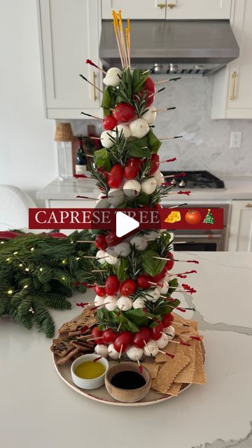 Nicolle Love | Cheese, Wine, Recipes & Dinner Parties on Instagram: "DETAILS HERE ✨⬇️

Some you all loved my charcuterie tree, here is the CAPRESE TREE 🍅🧀🎄

What you’ll need:

🧀 bocconcini
🧀 cherry tomatoes 
🧀 basil
🧀 fresh rosemary
🧀 styrofoam cone and toothpicks

Wrap the styrofoam cone in saran wrap to make it safe to stick your food items on with tooth picks. Use one food item at a time and go around your tree with it. Continue the process with another food to create a decorated tree effect (I stuck with a pattern of red, white and green)🎄✨ add in pieces of fresh rosemary to make it tree like. Then add crackers, olive oil and balsamic glaze around the base of your tree on a plate. TIP: stick extra toothpicks at the top of your tree to make it easy for guests to hold onto and p Olive Christmas Tree Appetizer, Styrofoam Tree Charcuterie, Caprese Christmas Tree, Charcuterie Christmas Tree Cone, Charcuterie Tree Cone, Charcuterie Tree, Tomato Mozzarella Basil, Christmas Salad, Cheese Wine