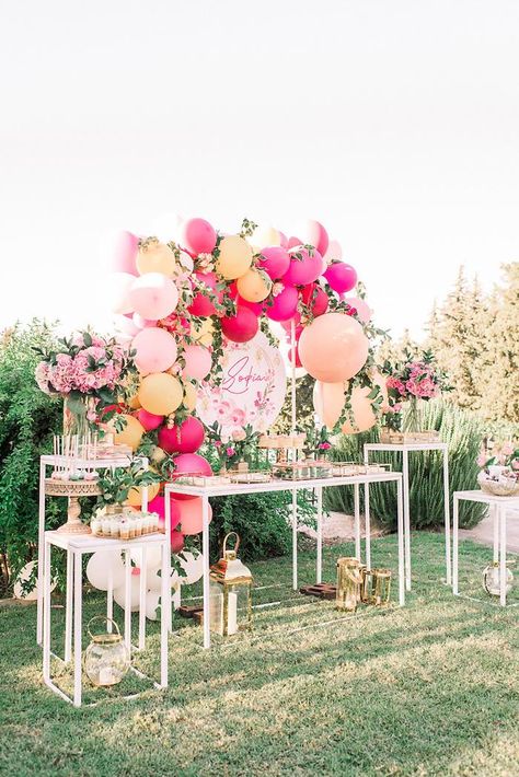 I'm simply stunned by this Elegant Floral Baptism Party by Katerina Aggeliniou of Golden Apple Weddings, out of Rhodes, Greece! Featuring a color palette of bright pinks and rich hues of gold, this celebration is truly a celebration to behold! So hurry on, take a look and get ready to be amazed by the following included details and much more: Gorgeous Floral-inspired Balloon Garland Dessert Table Backdrop Modern White Dessert Tables Stunning Floral Themed Sweets Elegant Gold Dessert Pedestals + Girl Baptism Party, White Dessert Tables, Boho Baby Nursery, Apple Wedding, Dessert Table Backdrop, Table Backdrop, Gold Dessert, Baptism Decorations, Floral Balloons