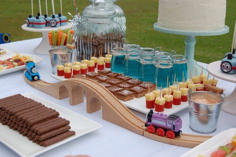 Thomas the tank engine dessert table. Blue Jelly cups. Train track Thomas Tank Engine, Train Birthday Theme, Train Party Decorations, Thomas Birthday Parties, Thomas Cakes, Thomas The Train Birthday Party, Thomas The Train Party, Jelly Cups, Thomas Birthday