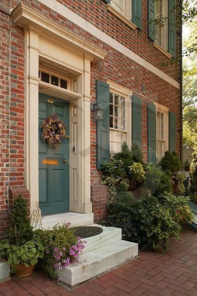 Orange Brick Houses, Brown Brick Houses, Grey Garage, Red Brick House Exterior, Cottage Patio, Green Shutters, Glass Railings, Orange Brick, House Shutters