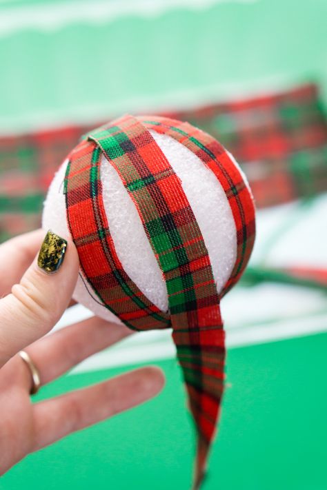 These DIY Holiday Rag Balls are a simple way to add a bit of holiday charm to your home. This craft project is super easy to make with just 4 materials! Makes great ornaments and party favors too! Styrofoam Ball Crafts, Ball Ornaments Diy, Holiday Fabric Crafts, Christmas Ball Ornaments Diy, Rag Balls, Sewn Christmas Ornaments, Fabric Balls, Christmas Ball Ornaments, Memory Crafts