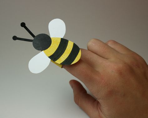 Bee Finger Puppet We used felt instead of paper/mom pre-cut per OG’s request (so glad I did!), 8 year old painted black stripes, together we hot glued parts. Bee Finger Puppet, Bumble Bee Craft, Bee Craft, Bee Crafts For Kids, Bee Activities, Bumble Bee Art, Bee Classroom, Bug Crafts, Finger Puppet