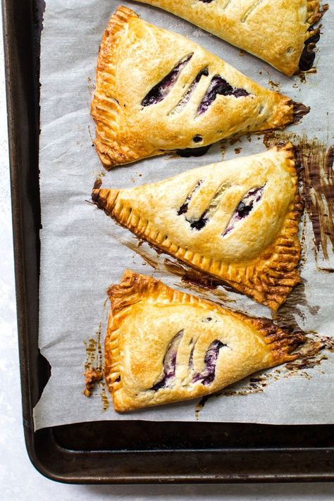 Freezer-Friendly blueberry hand pies made with store-bought pie dough, fresh blueberries and cream cheese. #pie #blueberrypie #creamcheese #breakfast #dessert #baking #blueberries #creamcheese #recipes #cooking Blueberry And Cream Cheese, Blueberry Cream Cheese Pie, Blueberry Hand Pies, Blueberries And Cream, Store Bought Pie Crust, Fruity Recipes, Cream Cheese Pie, Fried Pies, Dessert Breakfast