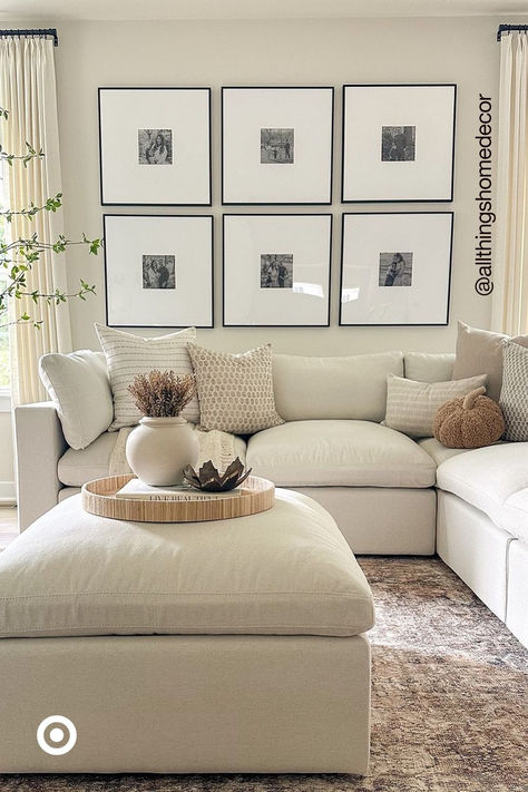 Bring a monochromatic vibe to your decor with framed wall art. Make a gallery-style grid of six frames if you love symmetry. This will add a touch of elegance to your living room or bedroom. Living Room Pillow Ideas Grey Couch, Pillows On Grey Couch, Ivory Living Room, Hamptons Decor, Grey Couch, Pumpkin Pillow, Apartment Makeover, Neutral Living Room, Pumpkin Decor